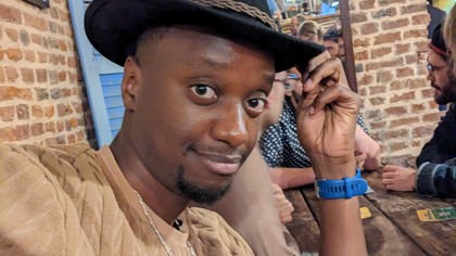 Me smiling because I'm surrounded by my friends.